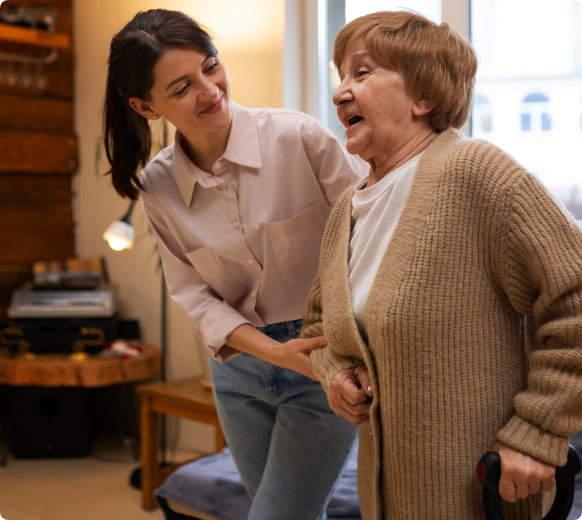 Caregiver providing toileting support to elderly client